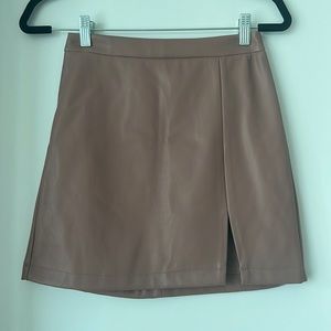 Mini vegan leather blush skirt